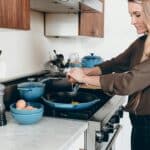 Natalie smiling in her kitchen – Home Cook Meals Recipes
