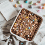 Easter Dirt Cake Casserole: No-Bake, Fun & Creamy Dessert 2 Recipe card and finished Easter dirt cake casserole next to candy decorations
