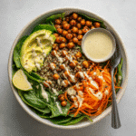Quinoa Protein Bowls with Roasted Chickpeas and Spinach 2 Assembled quinoa protein bowl with spinach, chickpeas, and tahini