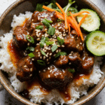 Hot Honey Beef Bowl 8 Hot honey beef bowl served with toppings and garnishes.