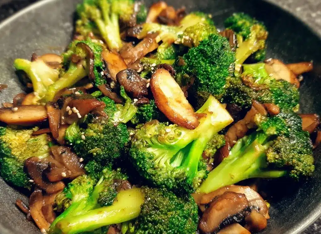 Vegan broccoli and mushroom stir fry served in a colorful bowl