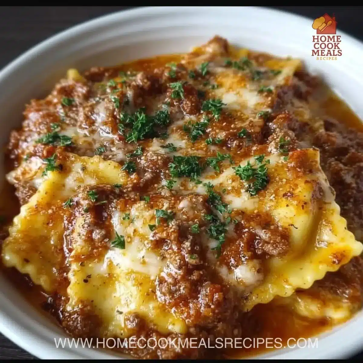 Crockpot Ravioli Lasagna layered in a slow cooker with cheese and marinara sauce