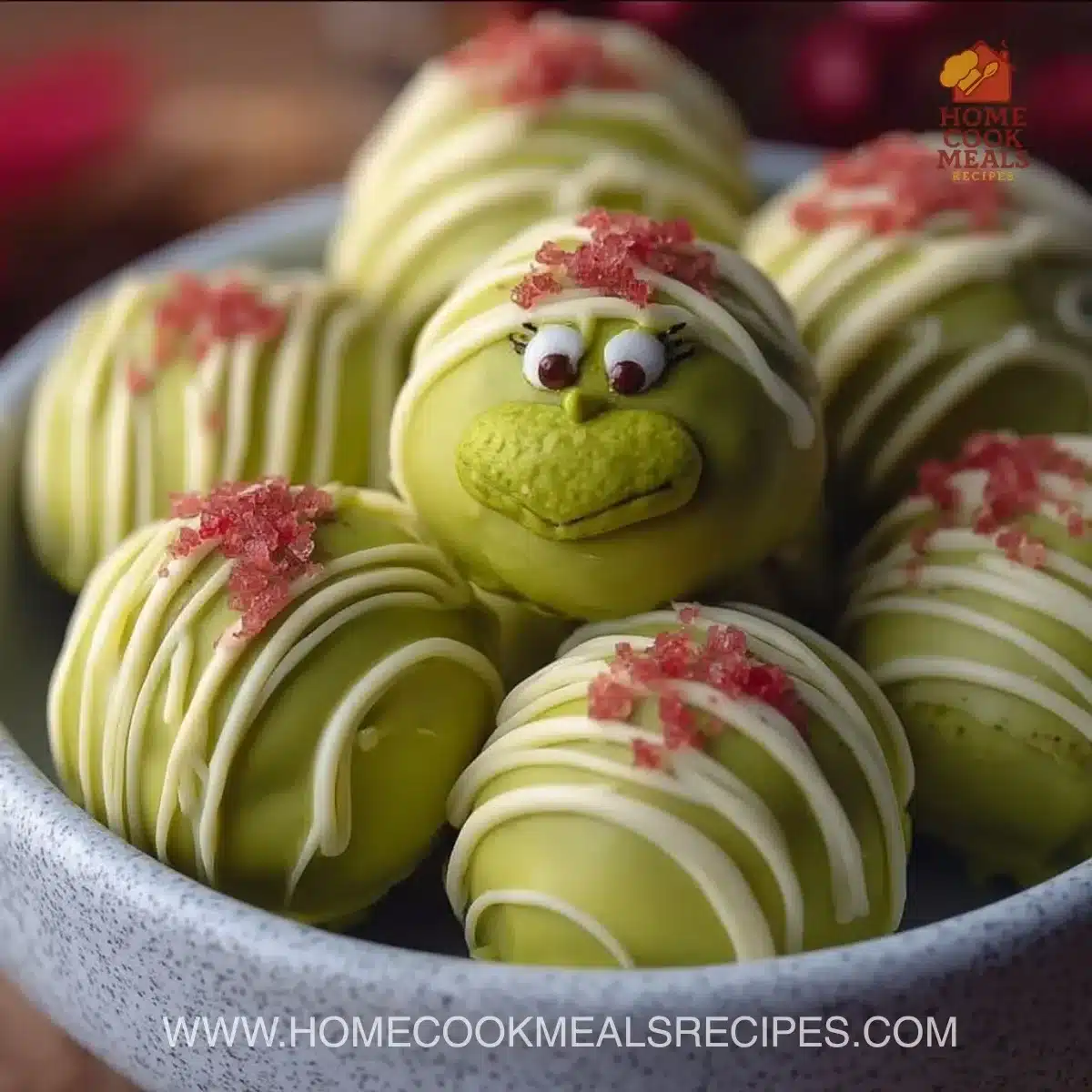 Festive Grinch Oreo Truffles decorated for the holiday season, green and red.