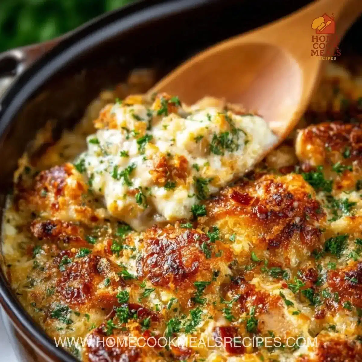 Delicious Million Dollar Chicken Casserole topped with cheese and herbs