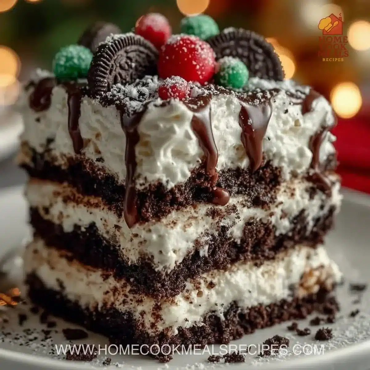 No-bake Christmas Oreo lasagna dessert with layers of cream and crushed Oreos.