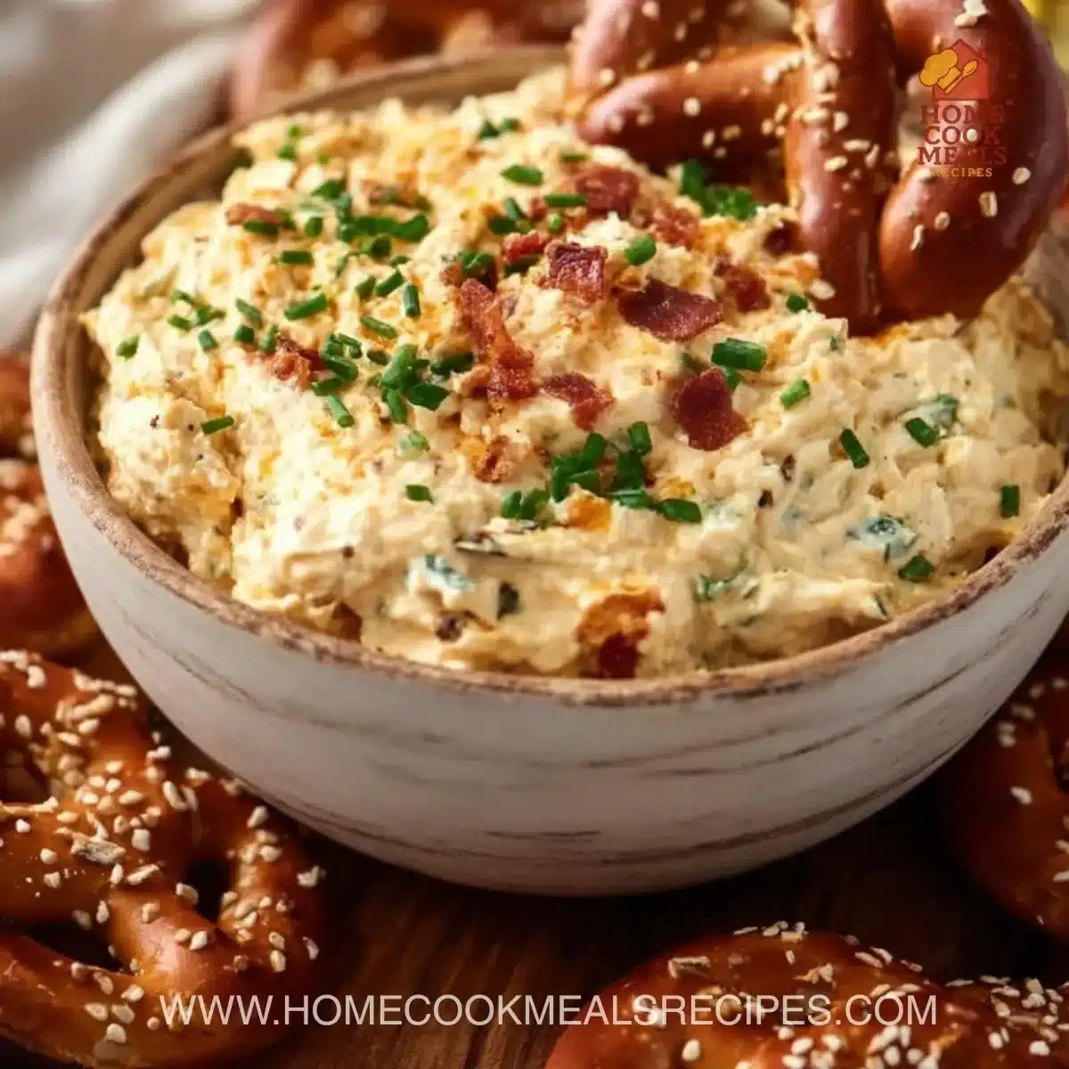 Creamy pretzel dip served with soft pretzels, a perfect snack for any occasion.