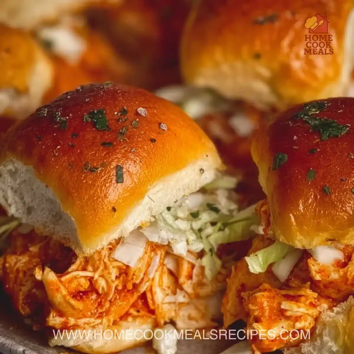 Spicy Buffalo Chicken Sliders with sauce and toppings on a platter