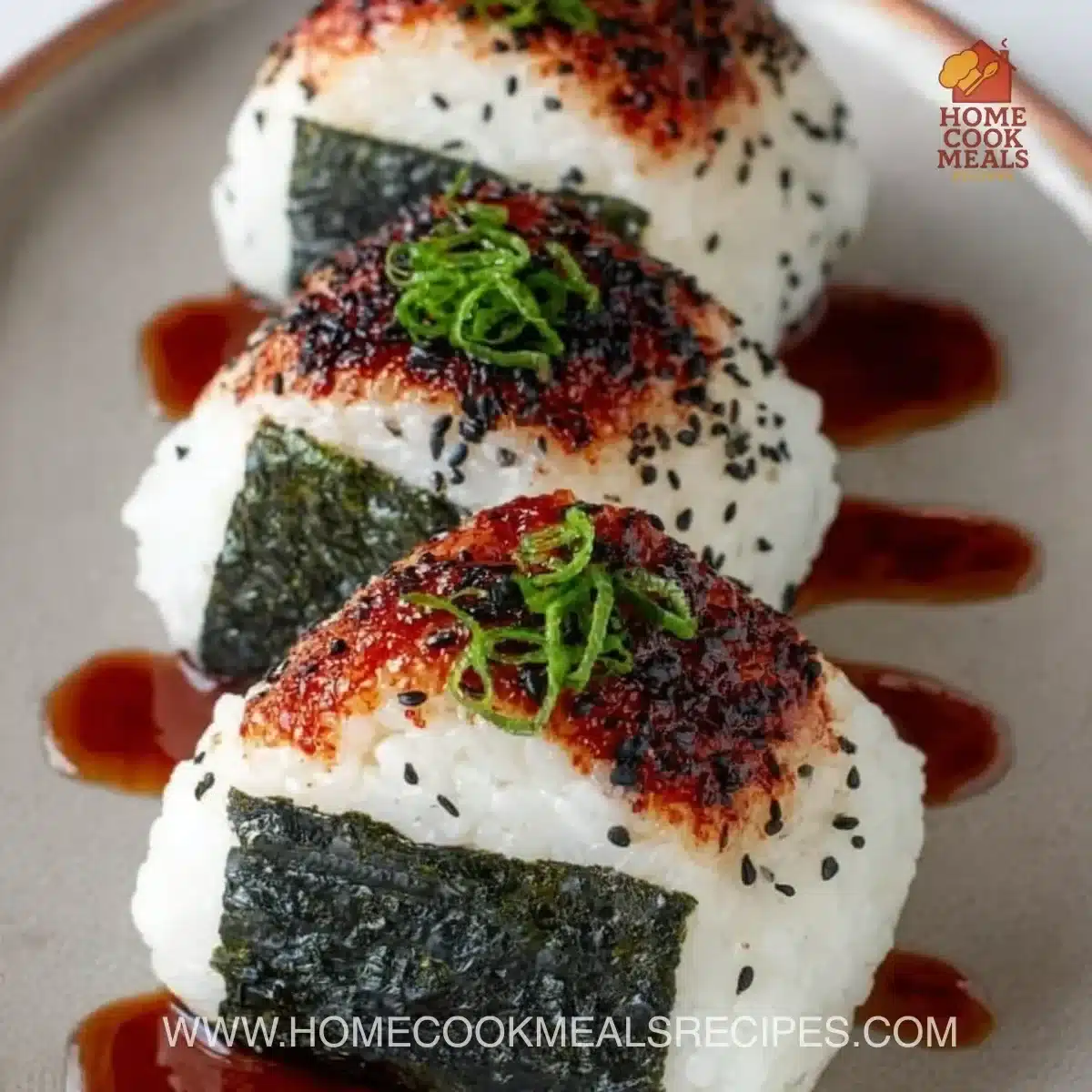 Handheld spicy tuna rice ball with fresh ingredients and a hint of spice