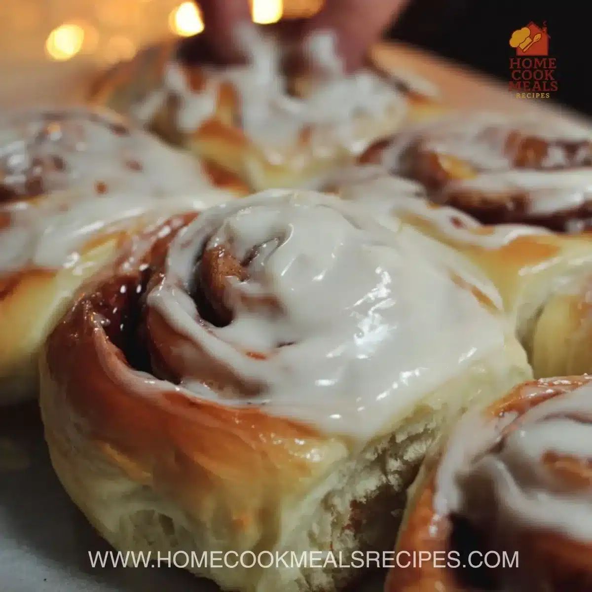 Delicious homemade cinnamon rolls with icing on top fresh from the oven