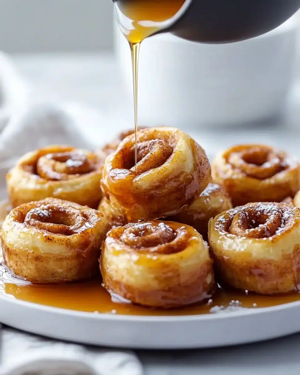 Delicious Cinnamon Roll French Toast Bites served on a plate with syrup