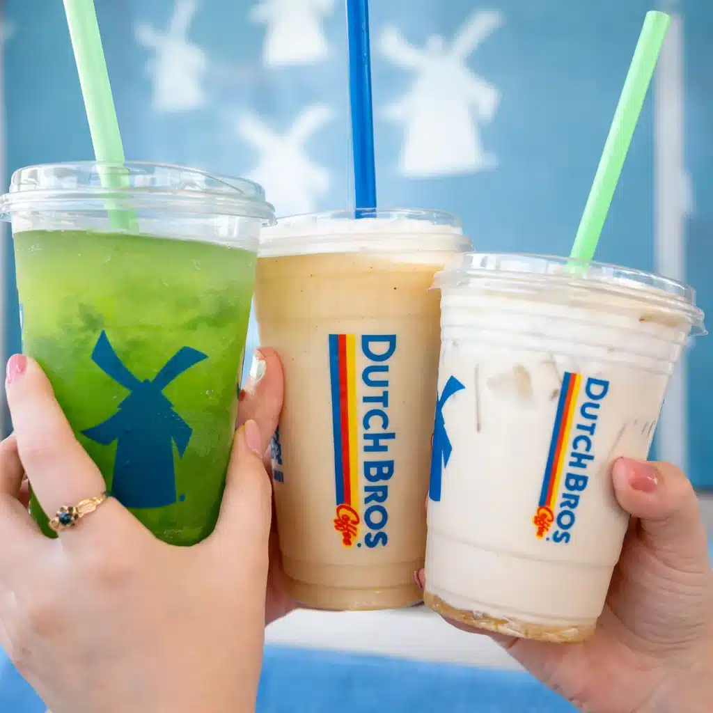 A selection of Dutch Bros drinks including iced coffee and blended beverages.