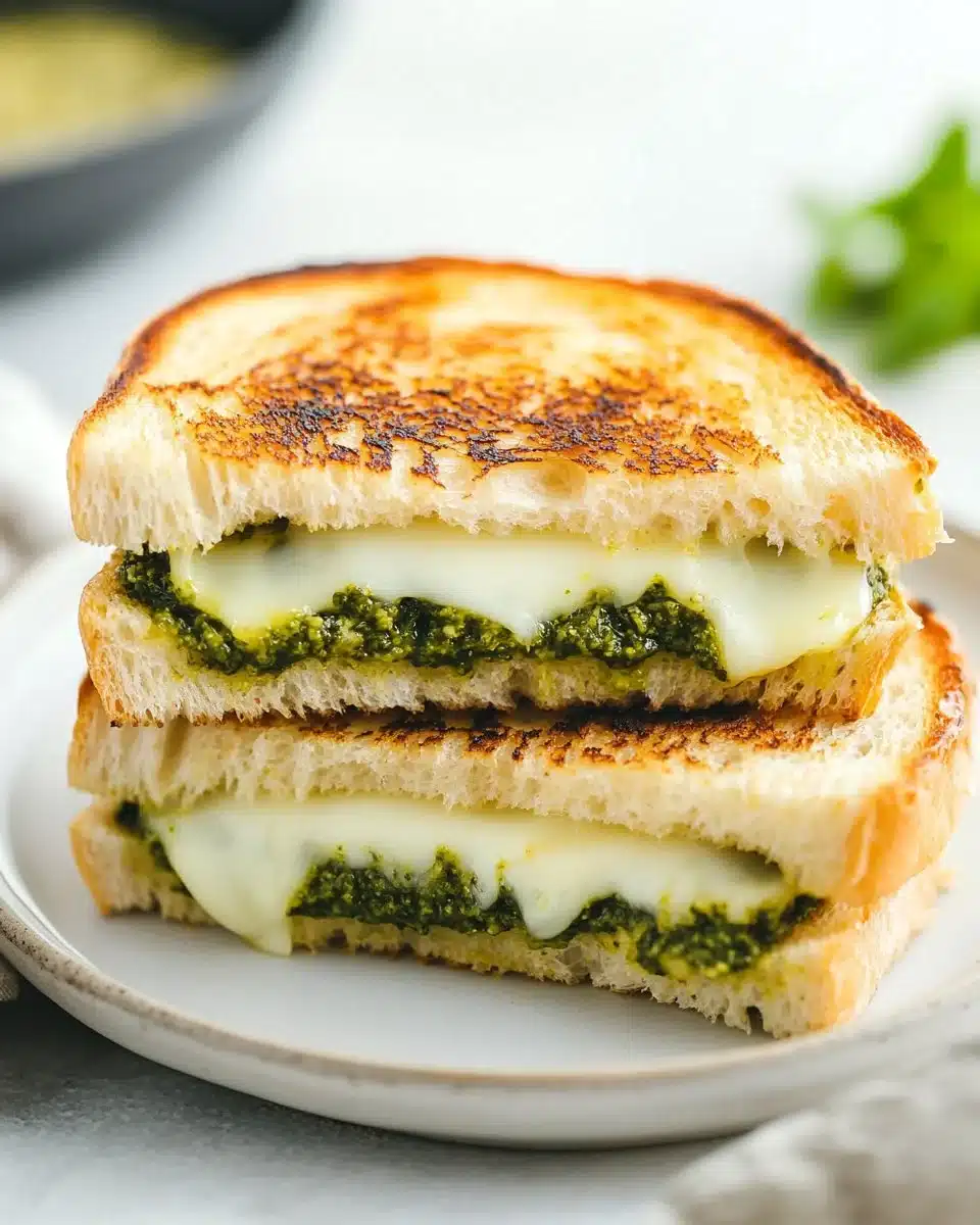 Delicious Pesto Grilled Cheese sandwich with melted cheese and fresh pesto