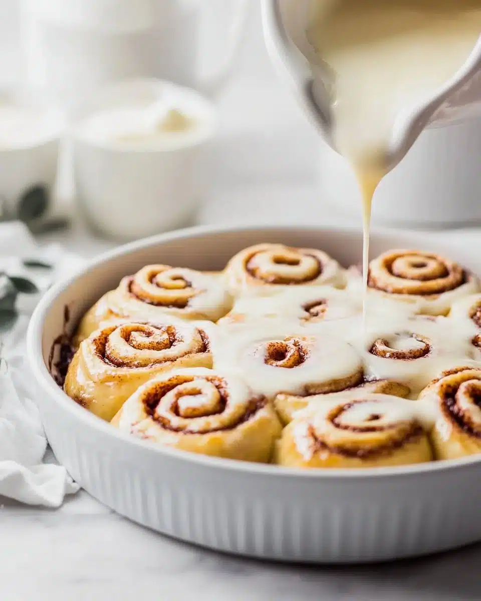 Red Velvet Cinnamon Rolls drizzled with cream cheese frosting
