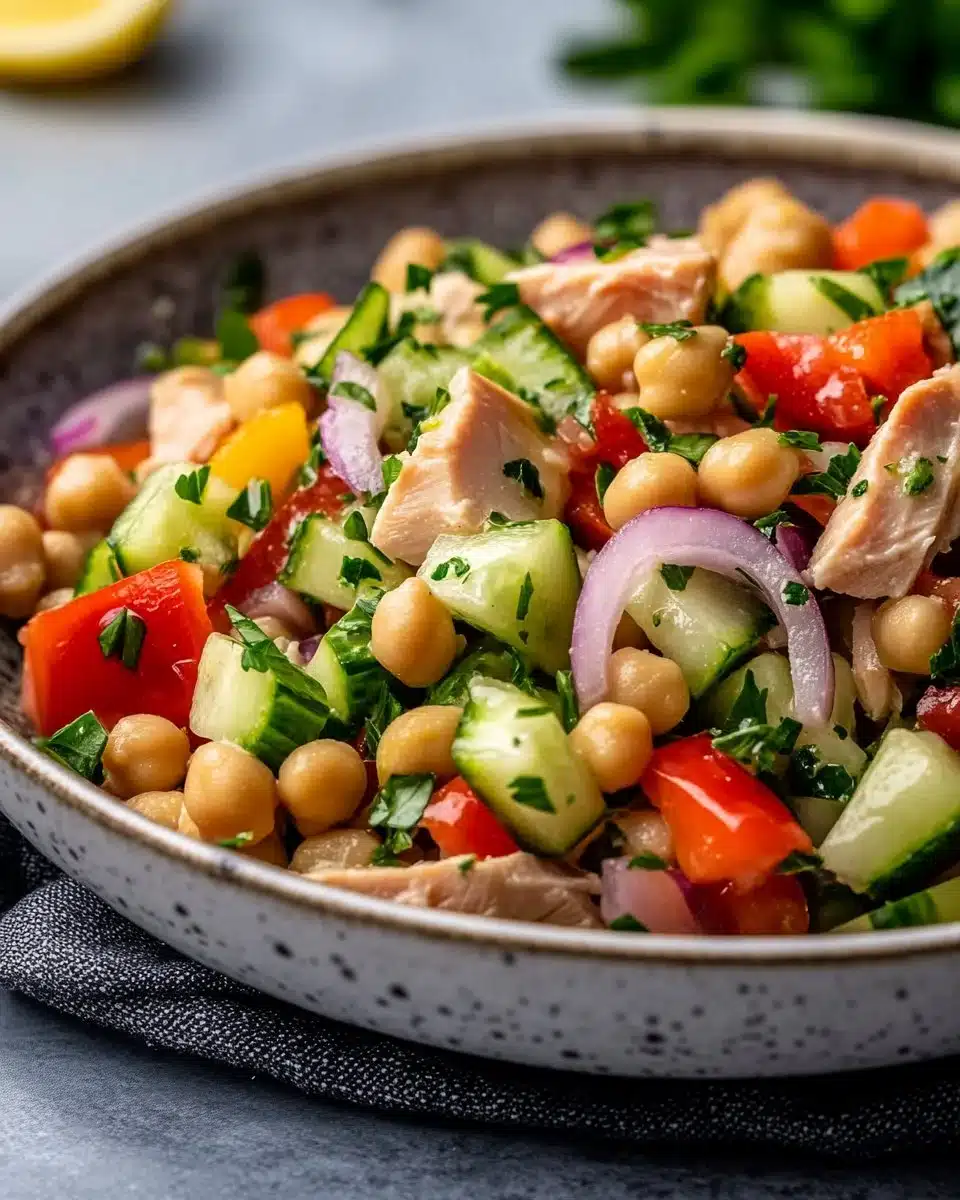 Bowl of simple tuna chickpea salad with fresh ingredients