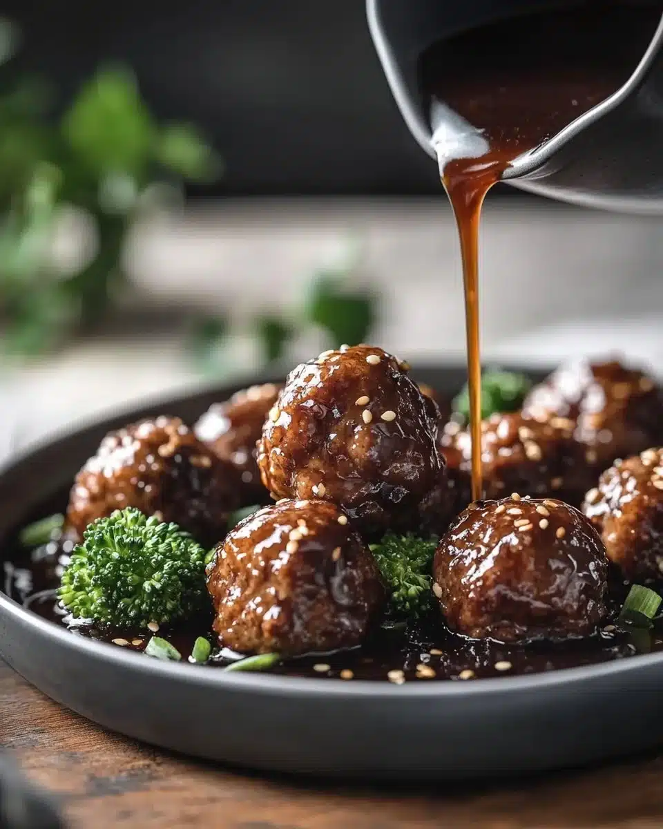 Sticky Mongolian Beef Meatballs served in a bowl with garnishes