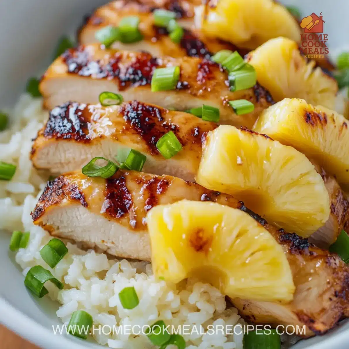 Hawaiian Chicken served with pineapple and coconut rice on a plate