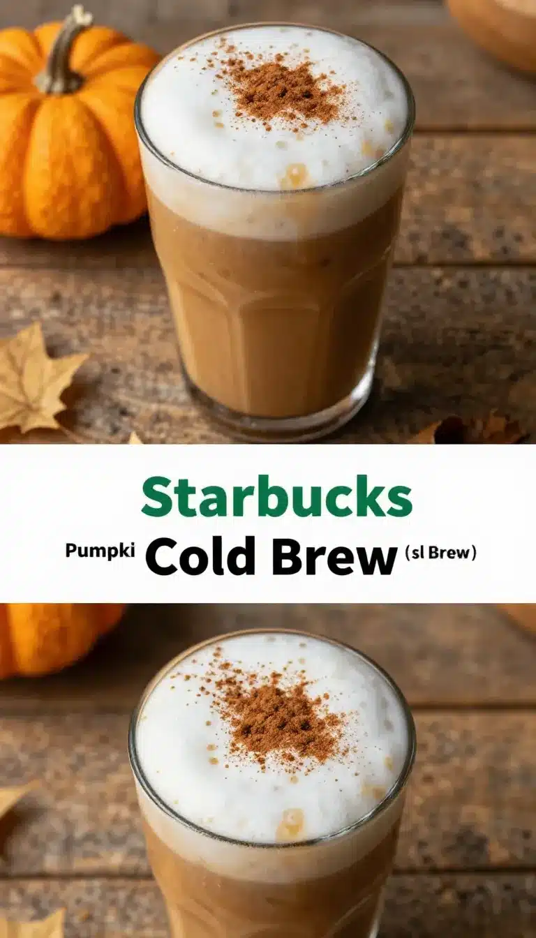 A glass of pumpkin cream cold brew with a layer of frothy cream on top, surrounded by autumn decorations.